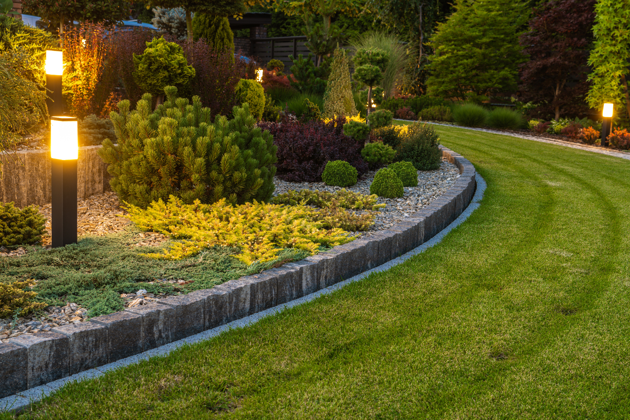 Lawn landscape in evening with lights