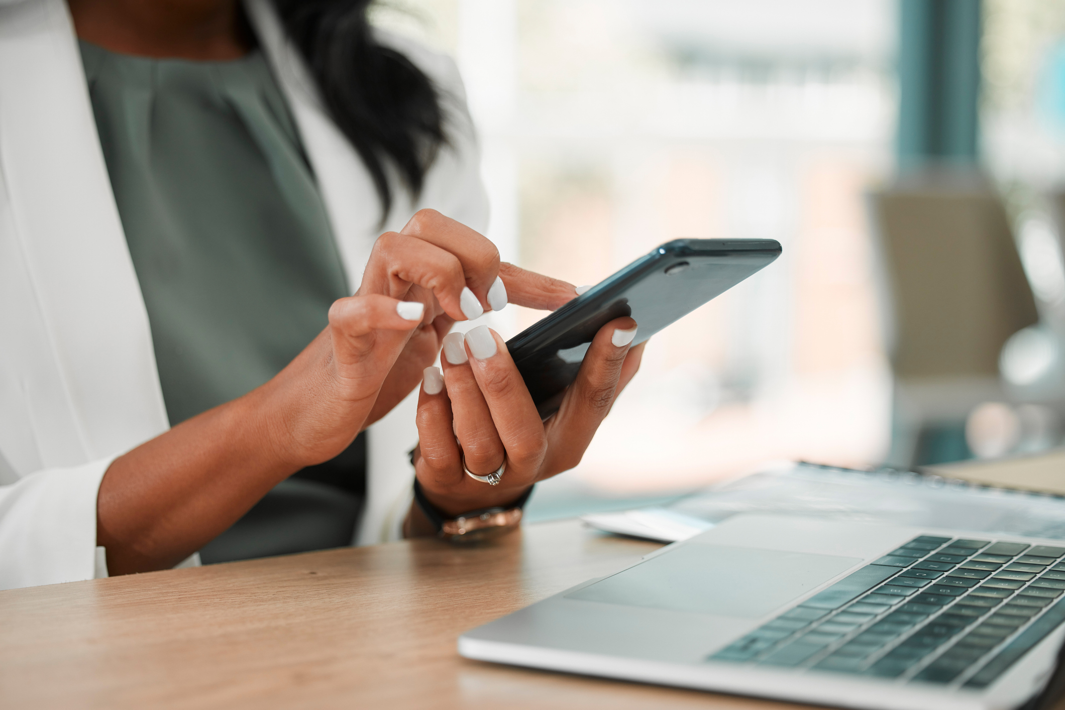 A woman using her mobile phone for work