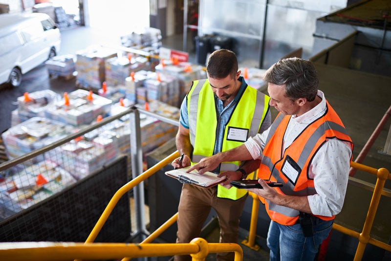 Two men checking inventory