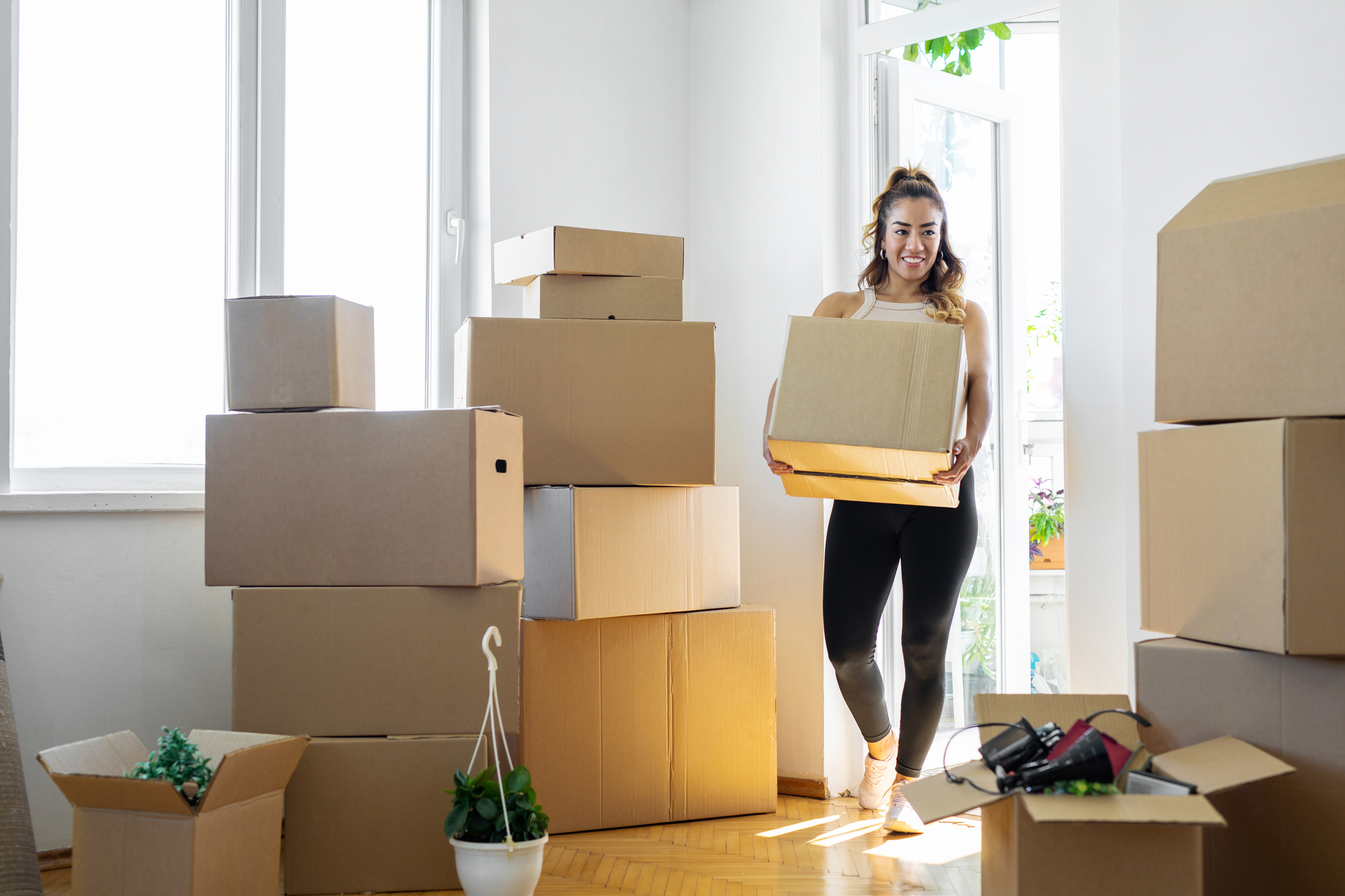 Woman moving into her new home